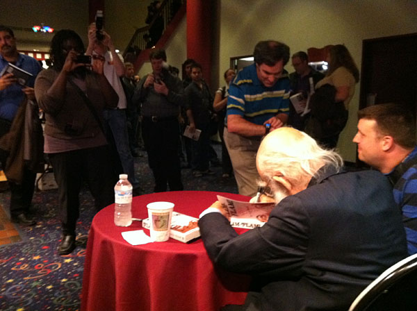 Canada-_Randi_signing_and_talking_to_reporter600